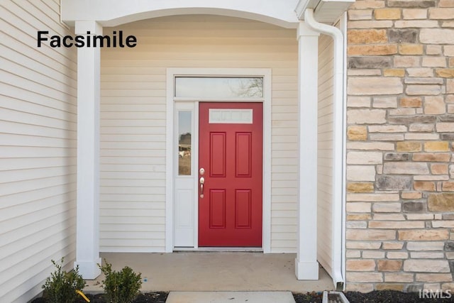 entrance to property with stone siding