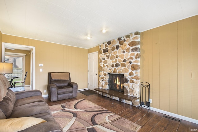 51821 Trowbridge Ln, South Bend, IN 46637 - living area with hardwood / wood-style floors, baseboards, a fireplace, and visible vents