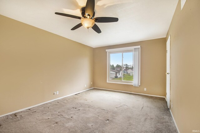 51821 Trowbridge Ln, South Bend, IN 46637 - unfurnished room featuring carpet floors, a ceiling fan, and baseboards