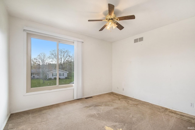 51821 Trowbridge Ln, South Bend, IN 46637 - empty room with a ceiling fan, visible vents, and carpet