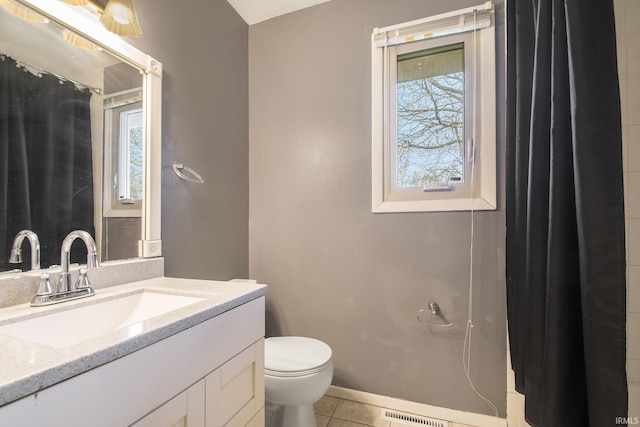 51821 Trowbridge Ln, South Bend, IN 46637 - full bathroom with tile patterned floors, vanity, baseboards, toilet, and visible vents