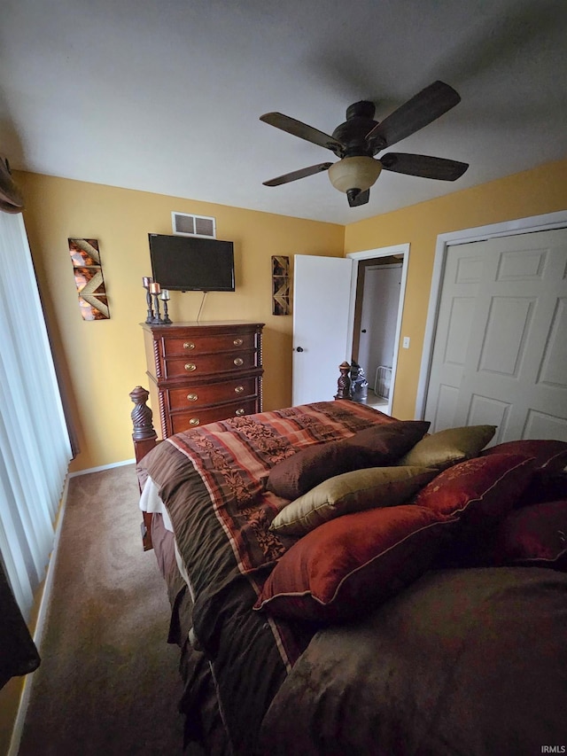 51821 Trowbridge Ln, South Bend, IN 46637 - bedroom featuring visible vents, a closet, baseboards, carpet flooring, and ceiling fan