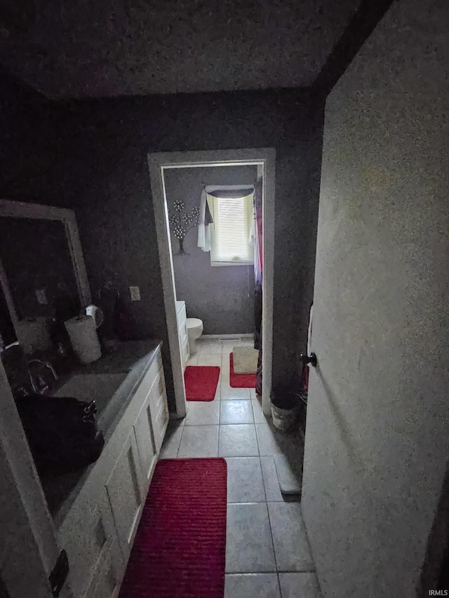 51821 Trowbridge Ln, South Bend, IN 46637 - bathroom featuring toilet and tile patterned floors