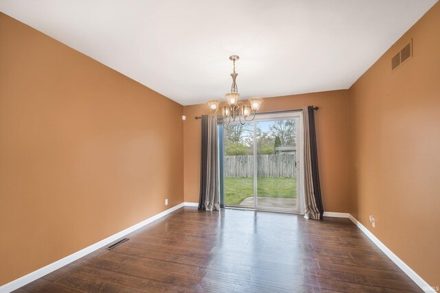 51821 Trowbridge Ln, South Bend, IN 46637 - unfurnished dining area featuring a chandelier, dark wood finished floors, visible vents, and baseboards