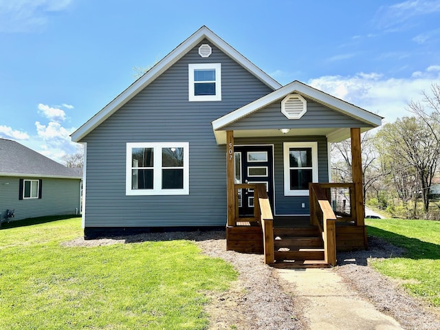 bungalow-style home with a porch and a front lawn