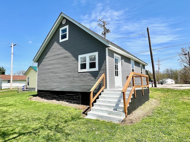 back of property with a yard
