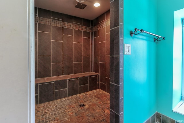 bathroom with tiled shower