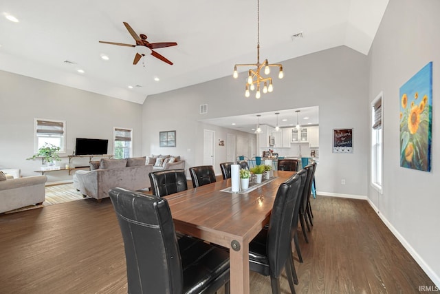 617 Pearl St, Culver, IN 46511 - dining area featuring visible vents, baseboards, dark wood finished floors, ceiling fan with notable chandelier, and high vaulted ceiling