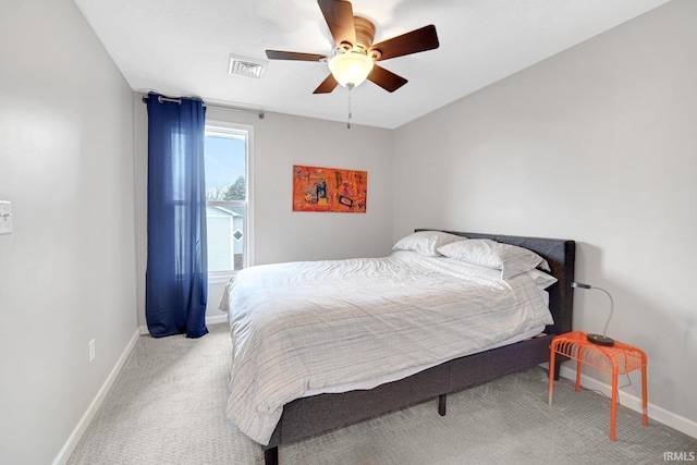 617 Pearl St, Culver, IN 46511 - carpeted bedroom with ceiling fan, baseboards, and visible vents