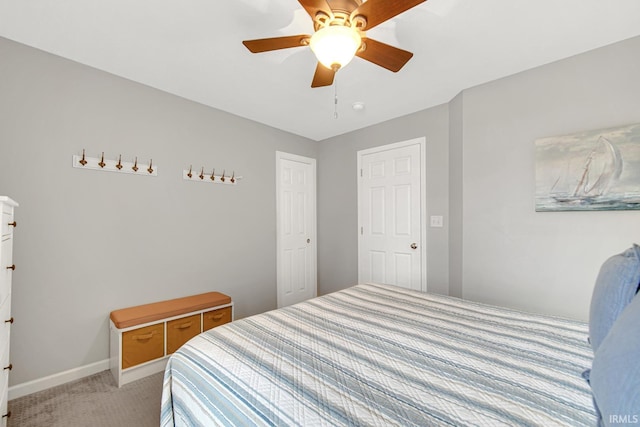 617 Pearl St, Culver, IN 46511 - bedroom featuring baseboards, a ceiling fan, and light colored carpet