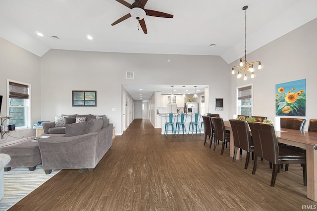 617 Pearl St, Culver, IN 46511 - dining room featuring visible vents, ceiling fan with notable chandelier, high vaulted ceiling, and dark wood-style floors