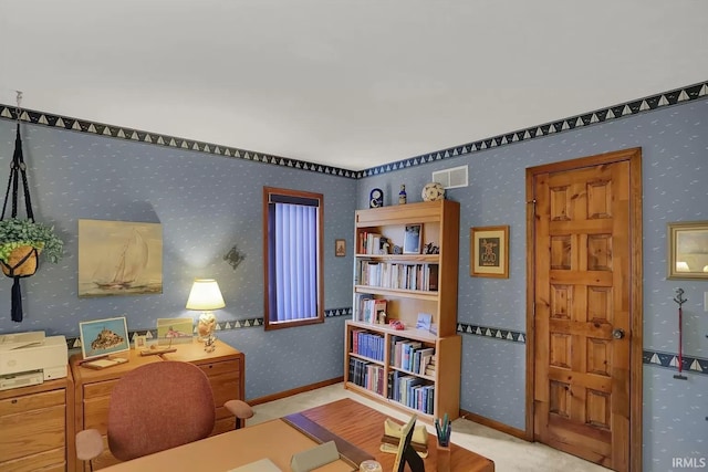 office with carpet flooring, visible vents, and wallpapered walls