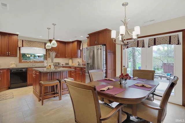 dining area featuring visible vents, recessed lighting, an inviting chandelier, and a healthy amount of sunlight