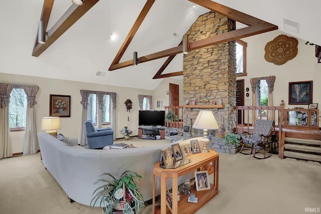 living room with high vaulted ceiling, beamed ceiling, visible vents, carpet flooring, and plenty of natural light