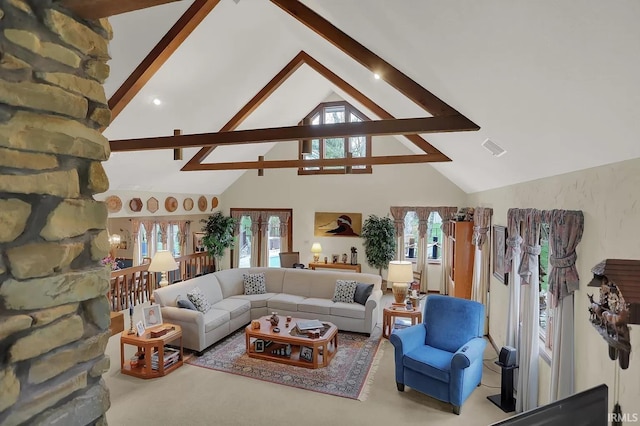 living area featuring visible vents, high vaulted ceiling, beam ceiling, and a healthy amount of sunlight