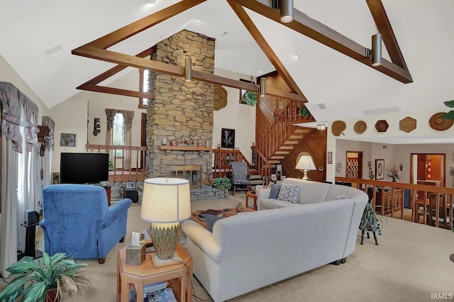 living room with high vaulted ceiling, visible vents, beamed ceiling, and carpet floors
