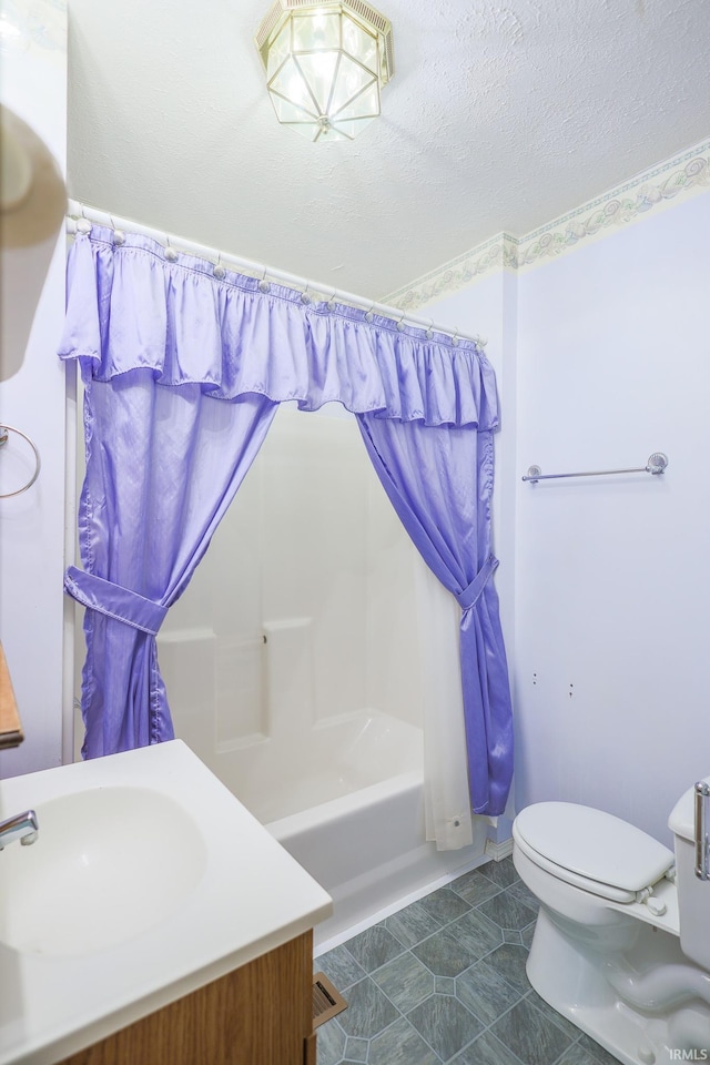 full bath with vanity, shower / bath combination with curtain, a textured ceiling, and toilet