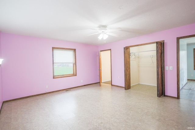 unfurnished bedroom featuring a closet, baseboards, a ceiling fan, visible vents, and light floors