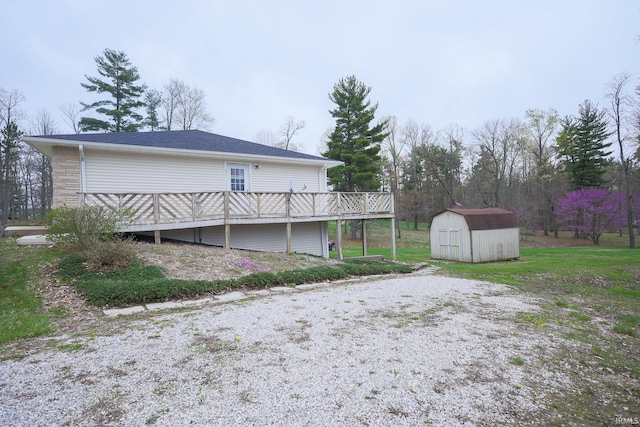 exterior space with an outbuilding, a deck, and a storage unit