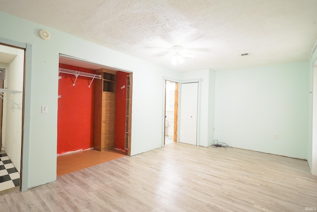 unfurnished bedroom featuring wood finished floors and a ceiling fan