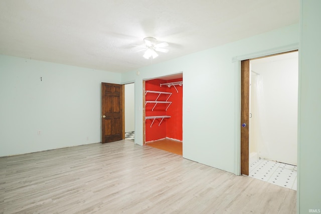 spare room featuring wood finished floors and ceiling fan