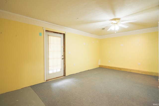 carpeted empty room with crown molding and ceiling fan
