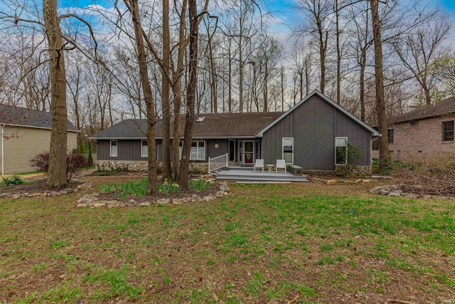 379 Pleasant View Dr, Evansville, IN 47711 - rear view of property featuring board and batten siding, a deck, and a yard