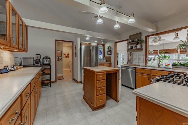 379 Pleasant View Dr, Evansville, IN 47711 - kitchen with tasteful backsplash, a ceiling fan, butcher block counters, appliances with stainless steel finishes, and a sink