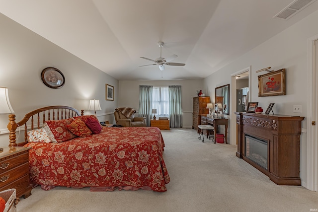 379 Pleasant View Dr, Evansville, IN 47711 - carpeted bedroom with a ceiling fan, a glass covered fireplace, and visible vents