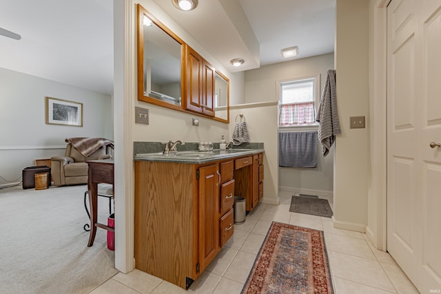 379 Pleasant View Dr, Evansville, IN 47711 - full bath featuring tile patterned floors, double vanity, a sink, and baseboards