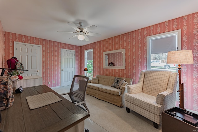 379 Pleasant View Dr, Evansville, IN 47711 - home office with wallpapered walls, light colored carpet, and a ceiling fan