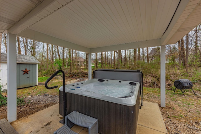 379 Pleasant View Dr, Evansville, IN 47711 - view of patio featuring a storage shed, an outdoor structure, and a hot tub
