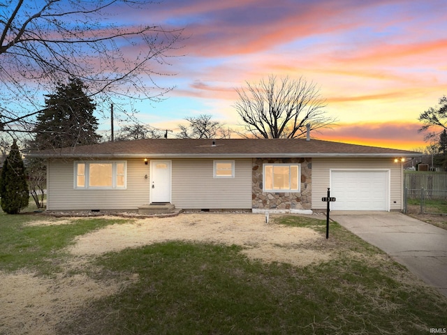 11314 NE Wawasee Dr, Syracuse, IN 46567 - single story home with concrete driveway, stone siding, a front lawn, an attached garage, and fence