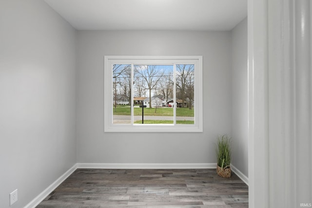 11314 NE Wawasee Dr, Syracuse, IN 46567 - spare room with baseboards and wood finished floors