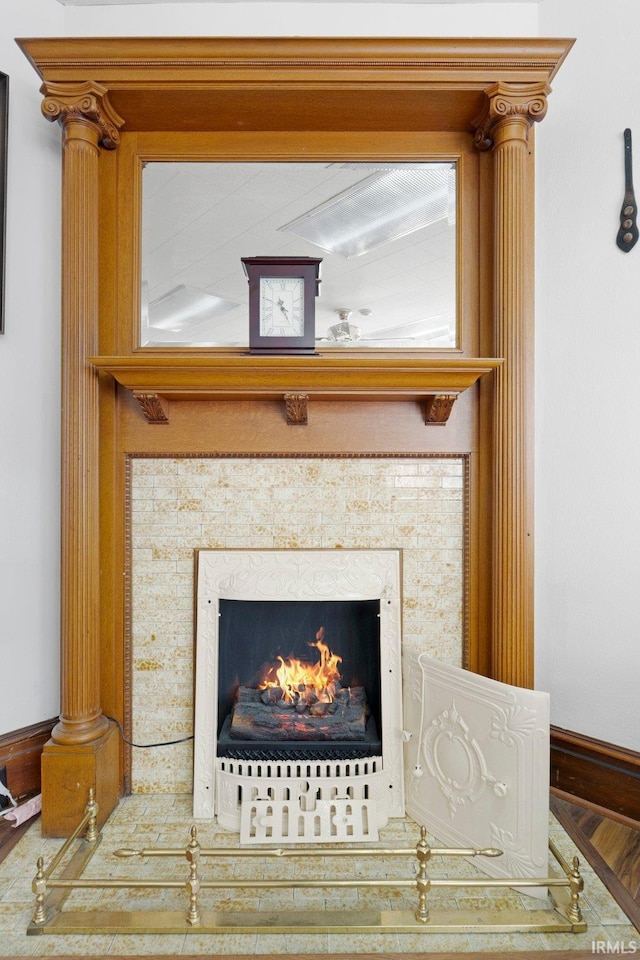 328 W Market St, Bluffton, IN 46714 - details featuring a high end fireplace, baseboards, and wood finished floors
