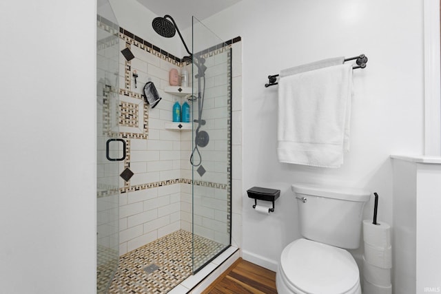 328 W Market St, Bluffton, IN 46714 - full bathroom featuring baseboards, wood finished floors, a shower stall, and toilet