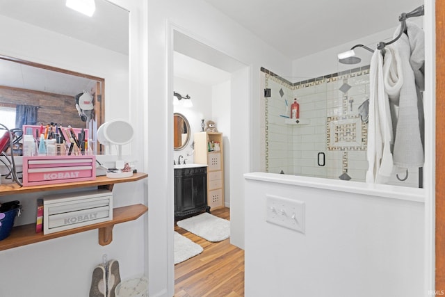 328 W Market St, Bluffton, IN 46714 - full bathroom featuring vanity, wood finished floors, and a stall shower