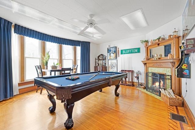 328 W Market St, Bluffton, IN 46714 - game room featuring billiards, wood finished floors, visible vents, a ceiling fan, and a fireplace