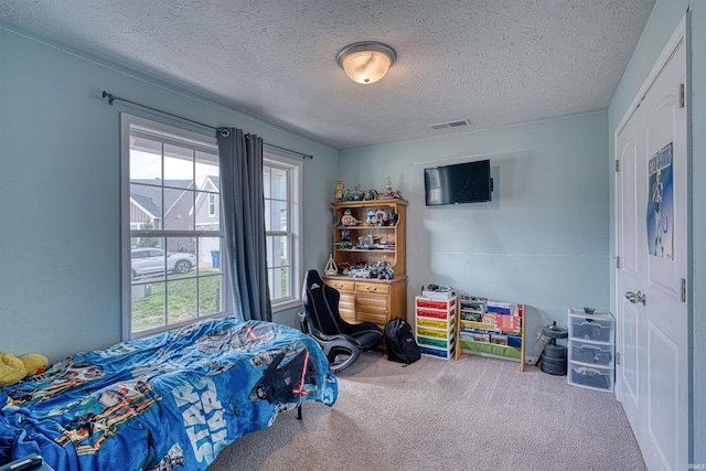 9919 Blyth Dr, Evansville, IN 47725 - carpeted bedroom featuring visible vents and a textured ceiling
