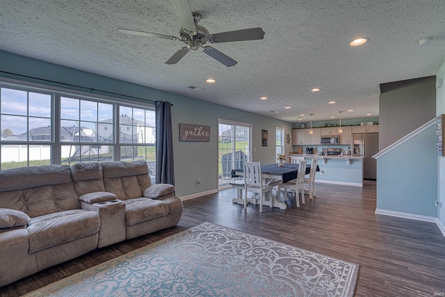 9919 Blyth Dr, Evansville, IN 47725 - living area with ceiling fan, visible vents, recessed lighting, baseboards, and dark wood-style floors
