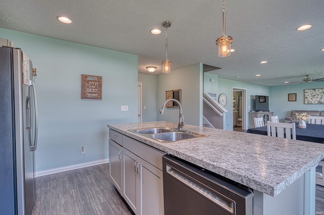 9919 Blyth Dr, Evansville, IN 47725 - kitchen featuring stainless steel fridge with ice dispenser, dishwasher, a sink, open floor plan, and an island with sink