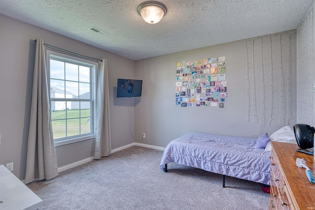 9919 Blyth Dr, Evansville, IN 47725 - bedroom with carpet flooring, visible vents, a textured ceiling, and baseboards