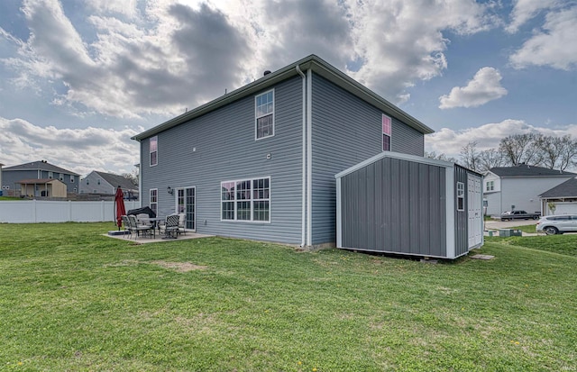 9919 Blyth Dr, Evansville, IN 47725 - back of property with fence, a patio, and a lawn