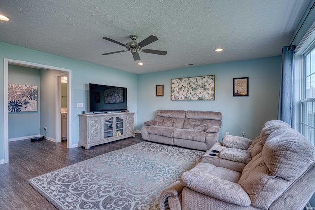 9919 Blyth Dr, Evansville, IN 47725 - living area with a textured ceiling, dark wood-style flooring, a ceiling fan, and visible vents