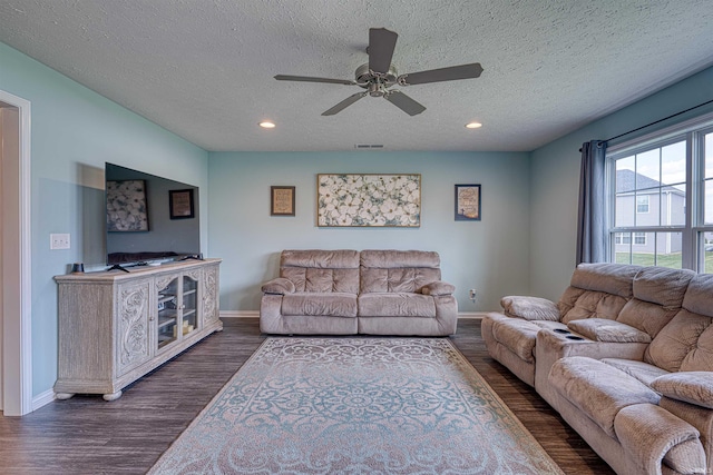 9919 Blyth Dr, Evansville, IN 47725 - living area featuring visible vents, baseboards, ceiling fan, and a textured ceiling