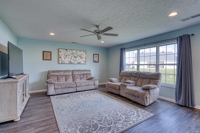 9919 Blyth Dr, Evansville, IN 47725 - living room with a textured ceiling, baseboards, and visible vents