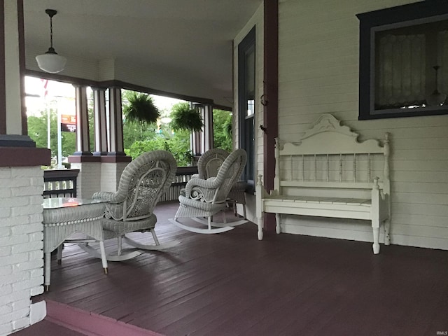wooden terrace featuring covered porch