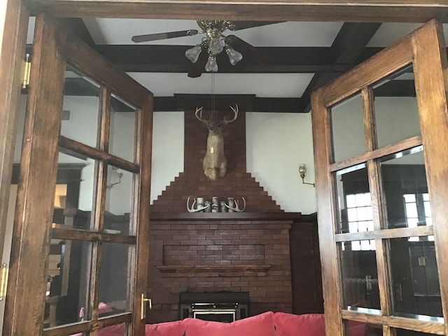 interior space featuring a ceiling fan and beam ceiling