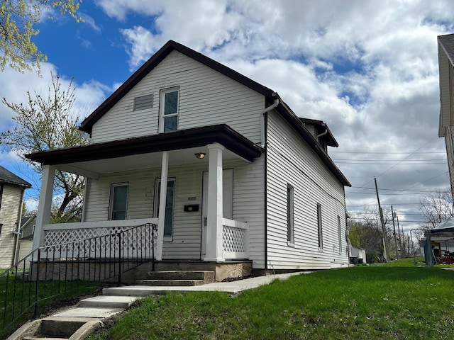 view of front facade with a porch and a front yard