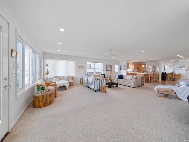 11523 N Crowdale Dr, Syracuse, IN 46567 - carpeted living area featuring a healthy amount of sunlight, ceiling fan, and recessed lighting
